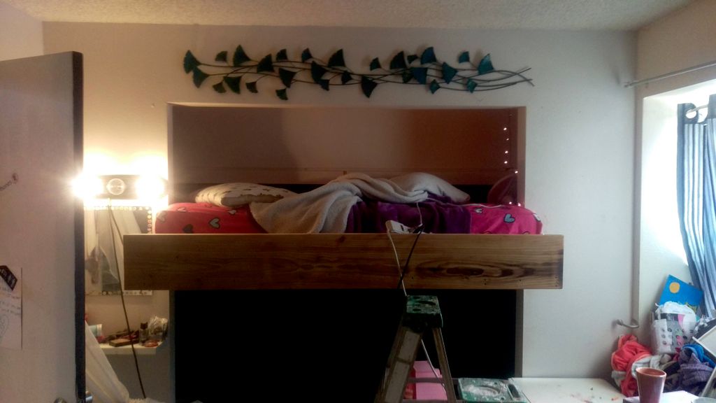 Inset bunk loft into former closet. 