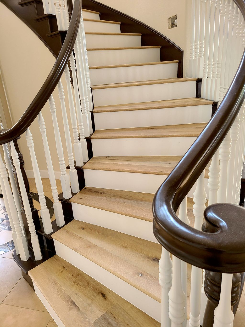 curved staircase with white risers