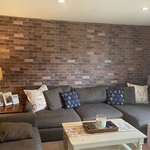 We had Eric install faux brick panels in our famil