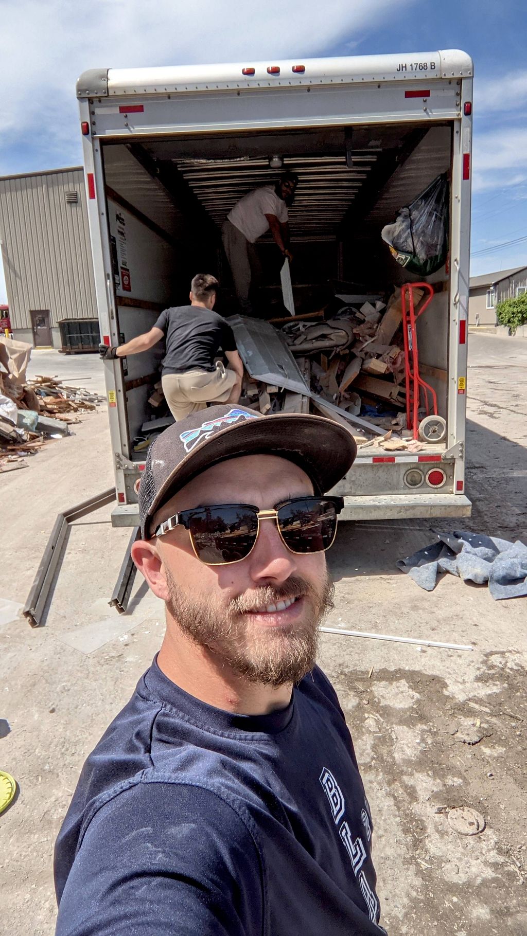 Andrew, Derek and Josh unloading mixed junk at the