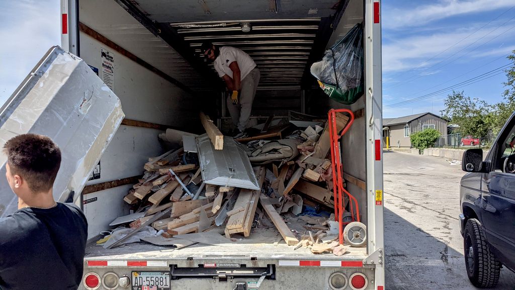 Josh and Derek working hard unloading 4,000lbs of 