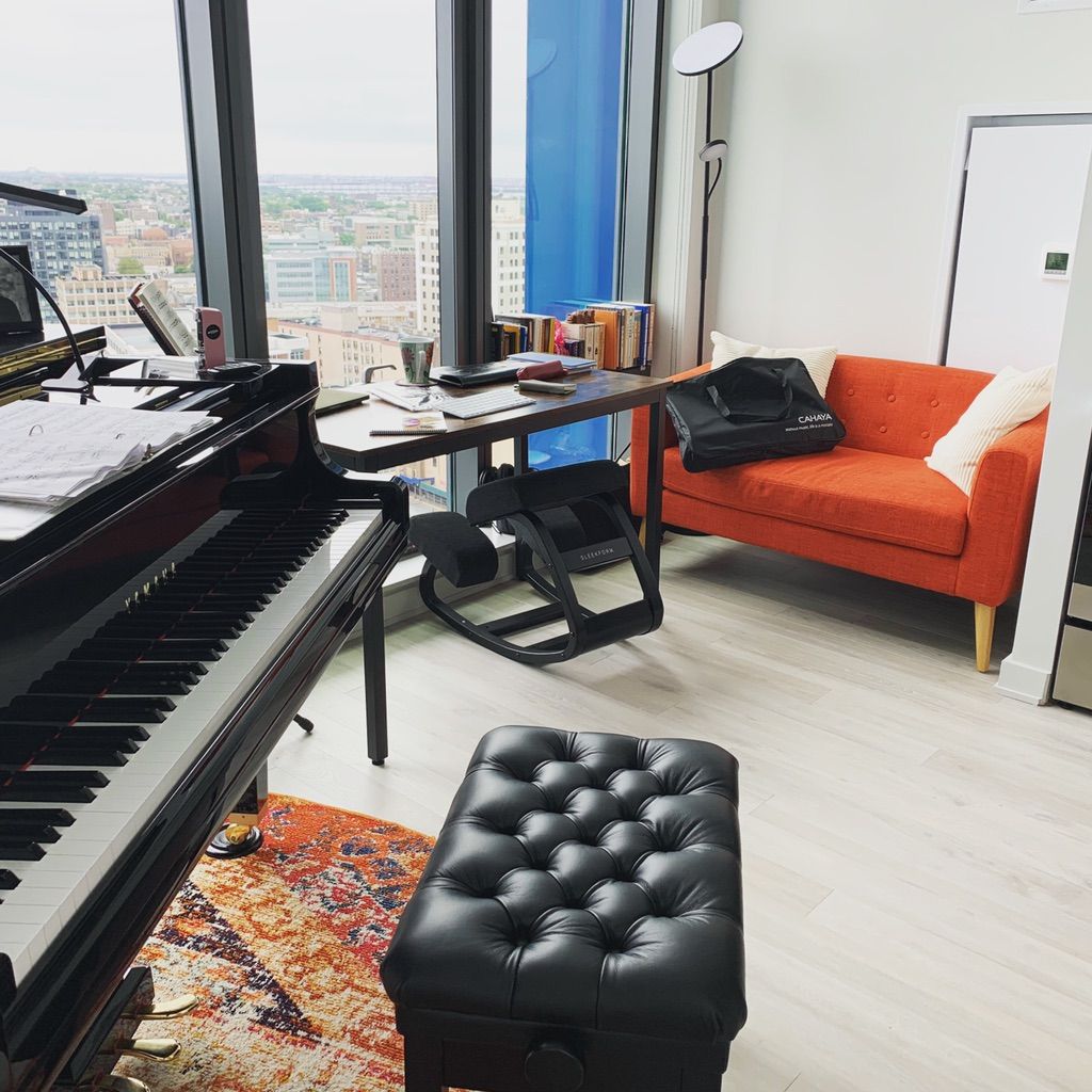 Home studio teaching with a Yamaha GC1 grand piano