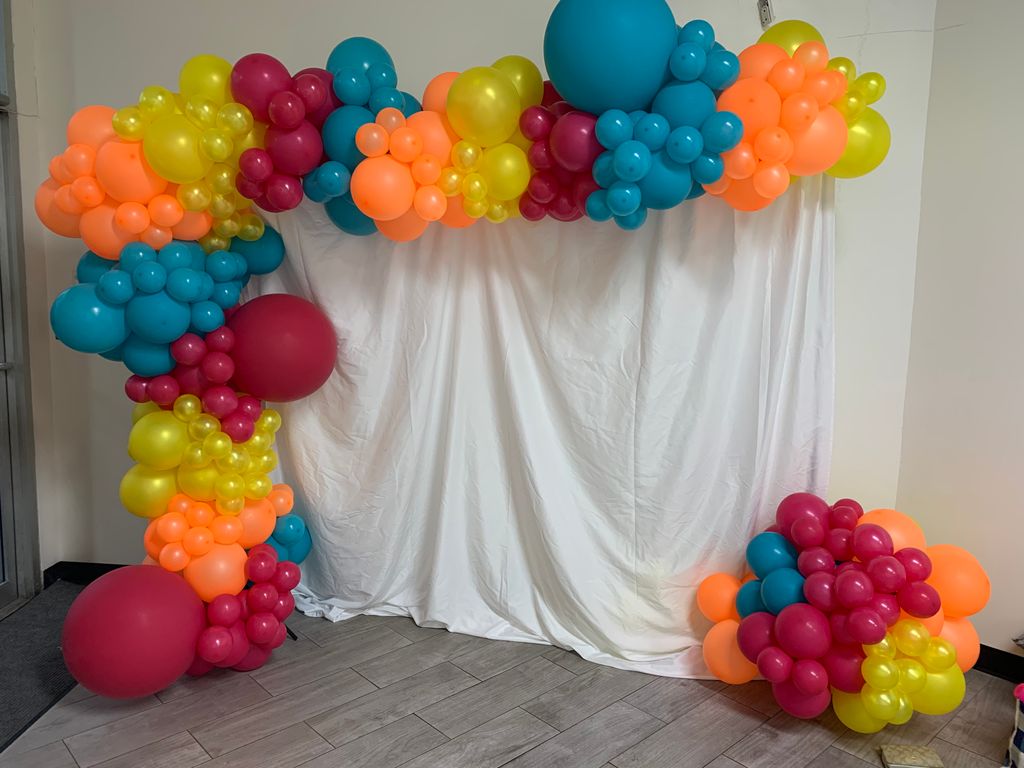 Colorful balloon garland and backdrop by @balloons