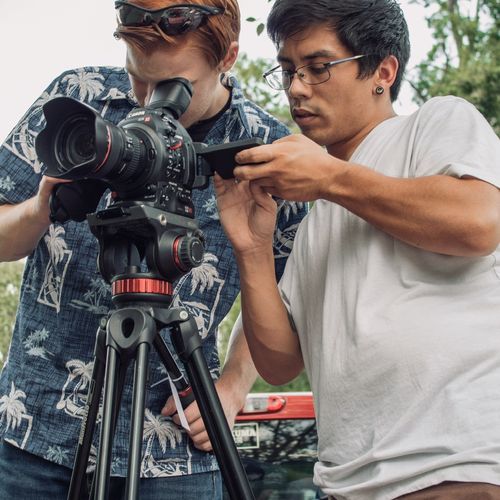 I’m on the right, directing my DP while working on