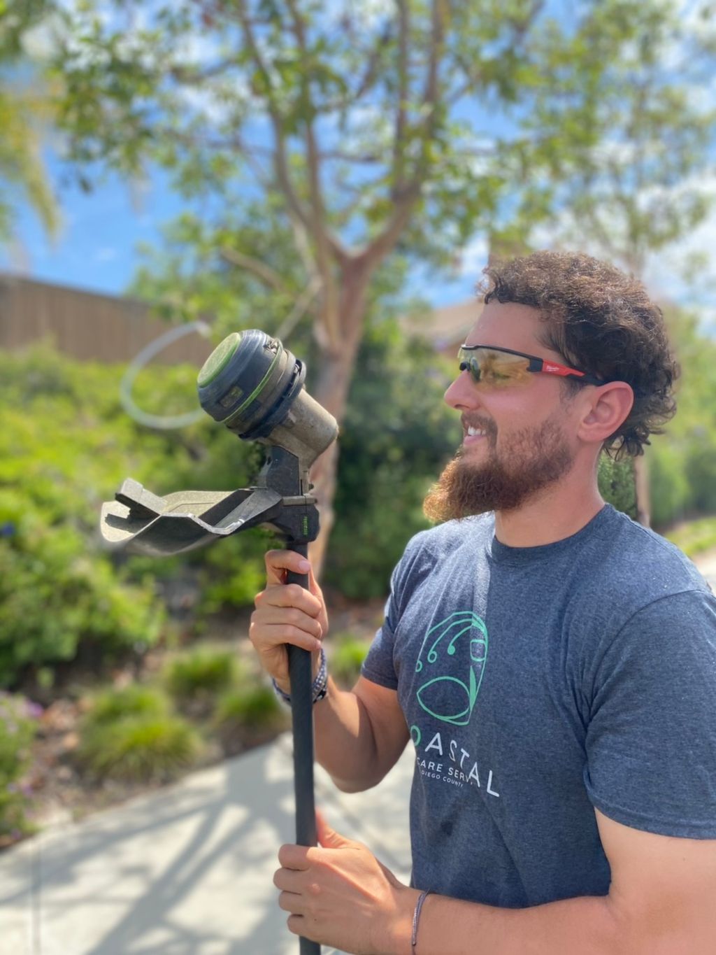 Mike is very fond of his electric weed whacker. 