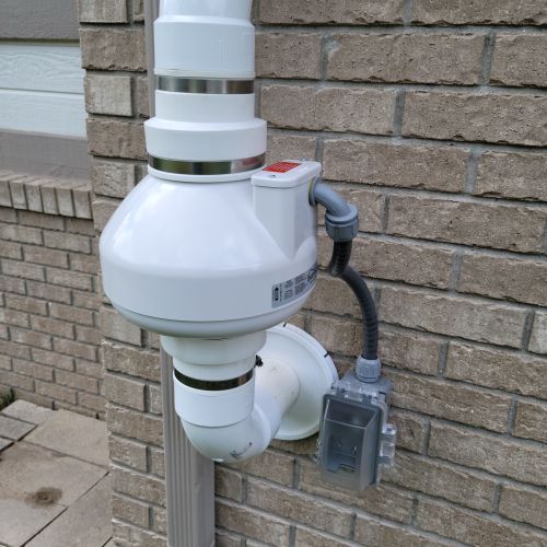 Radon Mitigation Fan and Disconnect Through Brick 