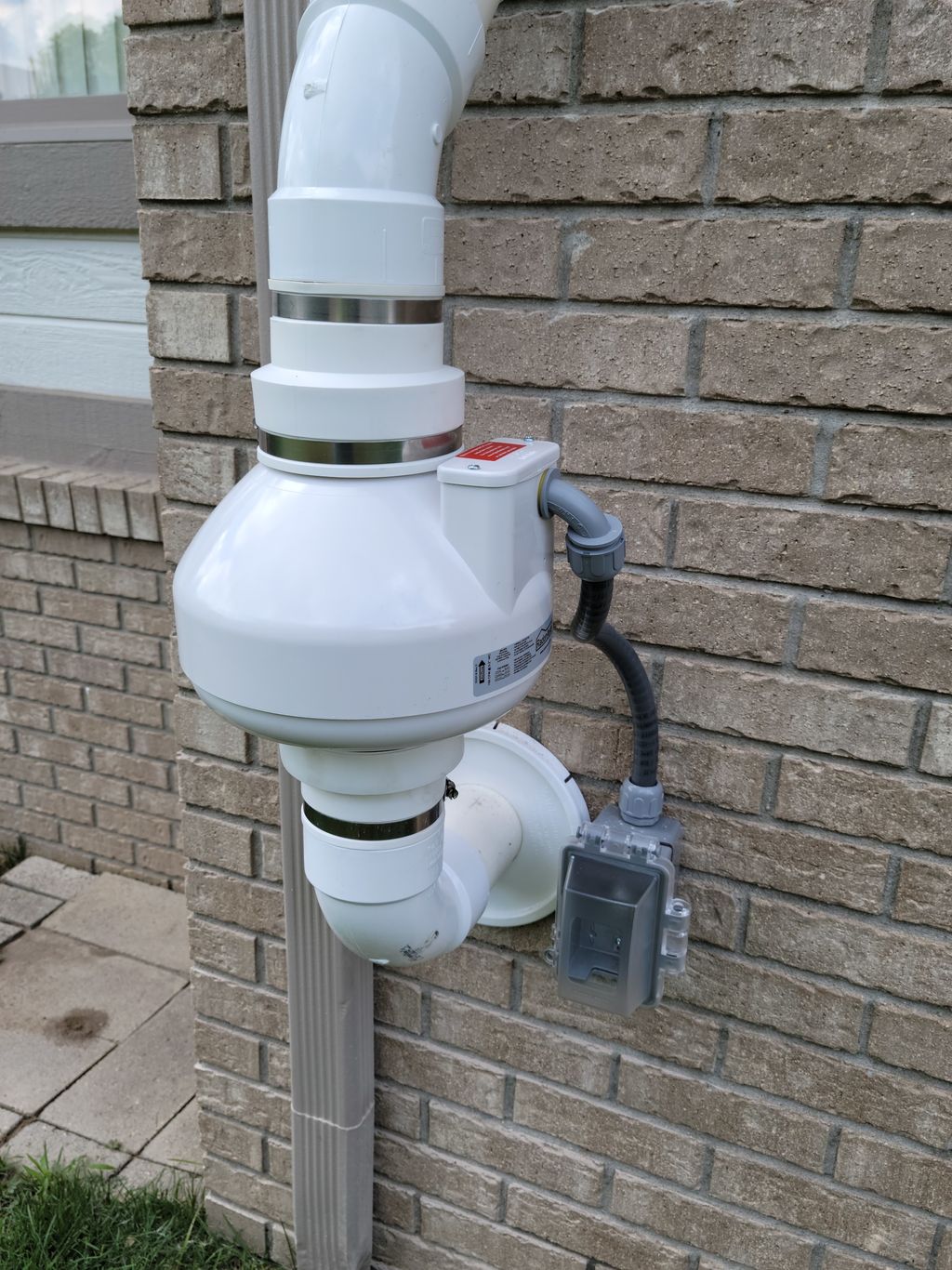 Radon Mitigation Fan and Disconnect Through Brick 