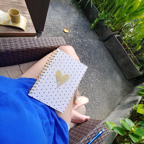 Journaling in Bali after completing a morning roof