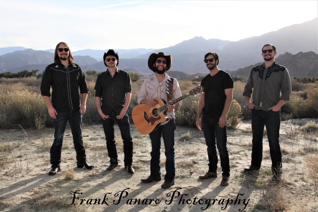 Just Dave Band posing in the desert