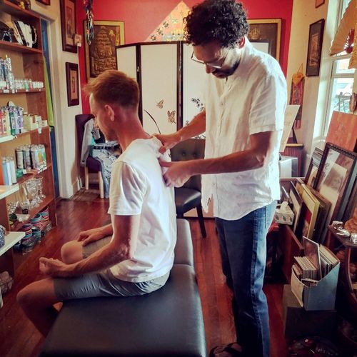 Chiropractic adjustment on a yogi and shop owner