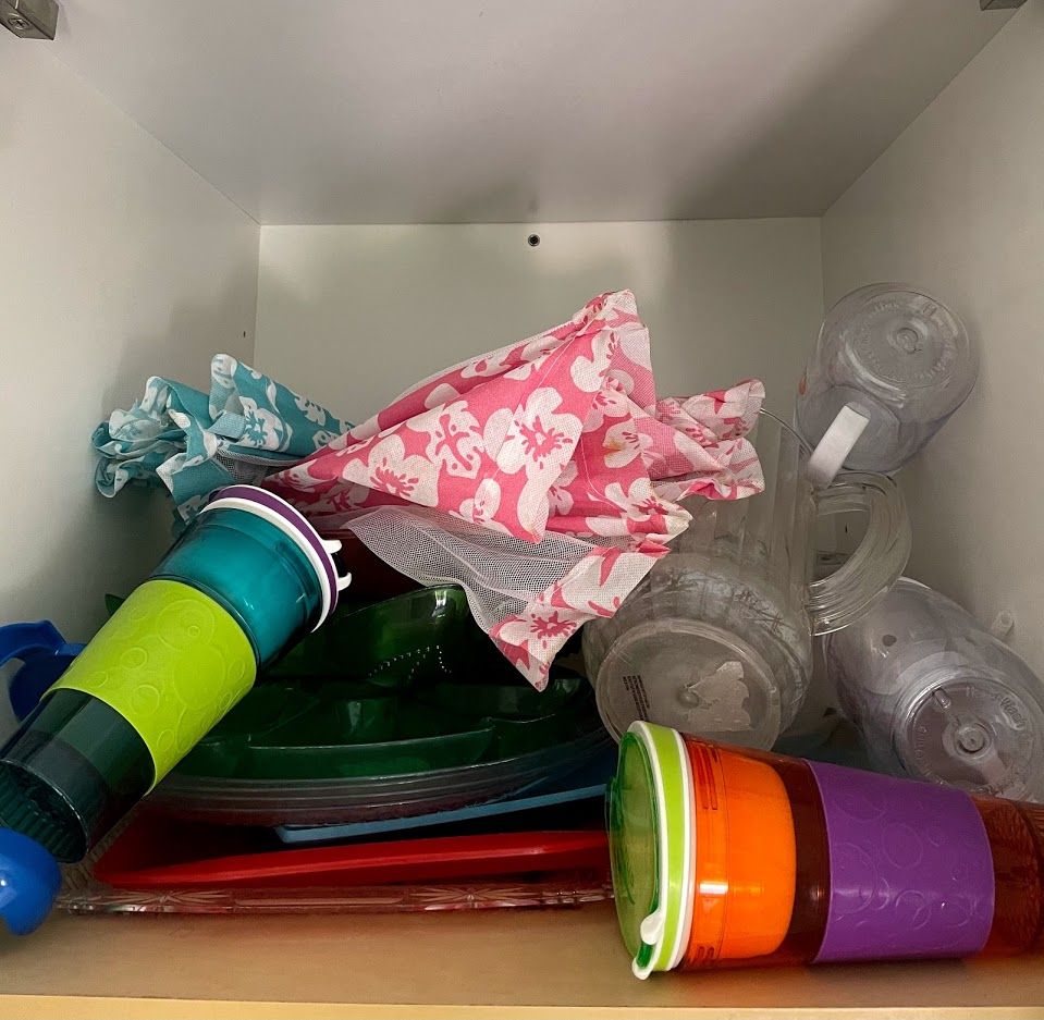 Over head cabinet full of junk