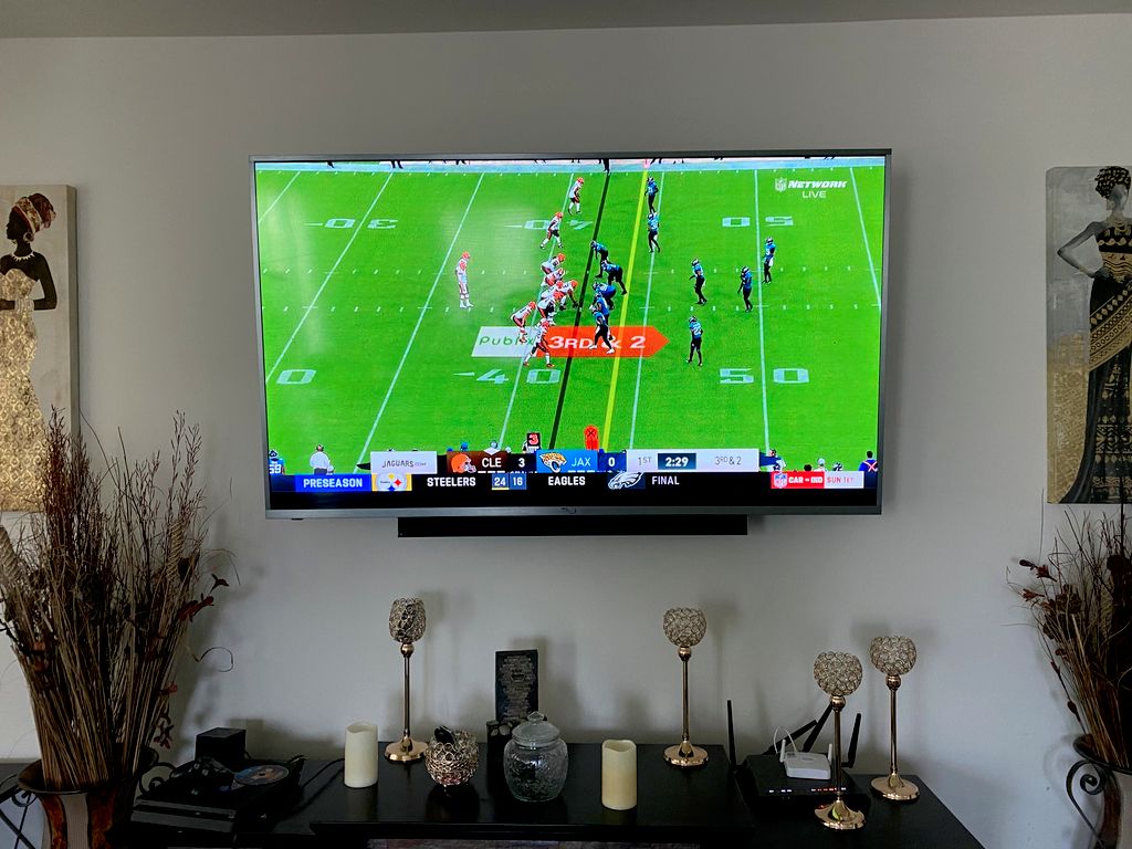 Living room 75" tv wall mount with sound bar and c
