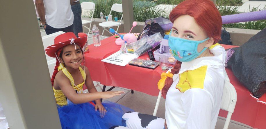 Jessie getting ready to paint the birthday girl!