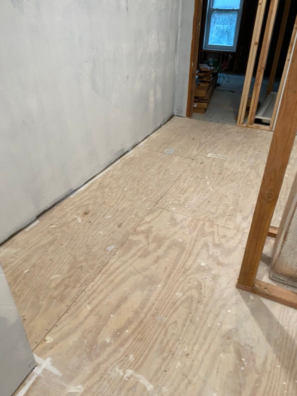 Before photo of subfloor in walk in closet. 