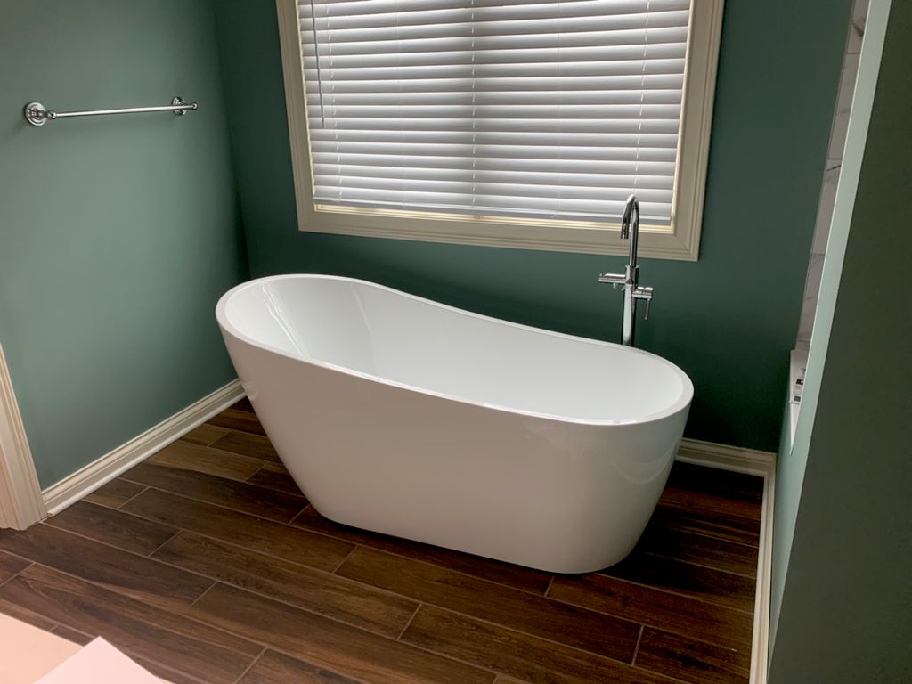 Freestanding tub with Roman faucet