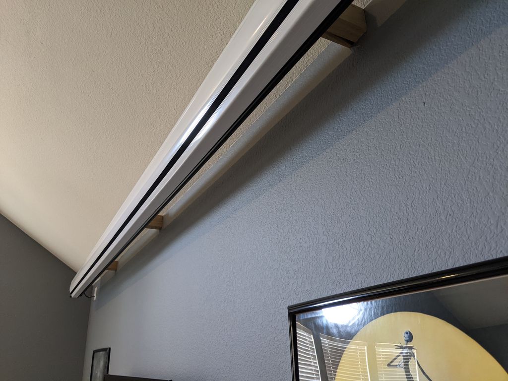 Projector screen mount to drop in front of TV