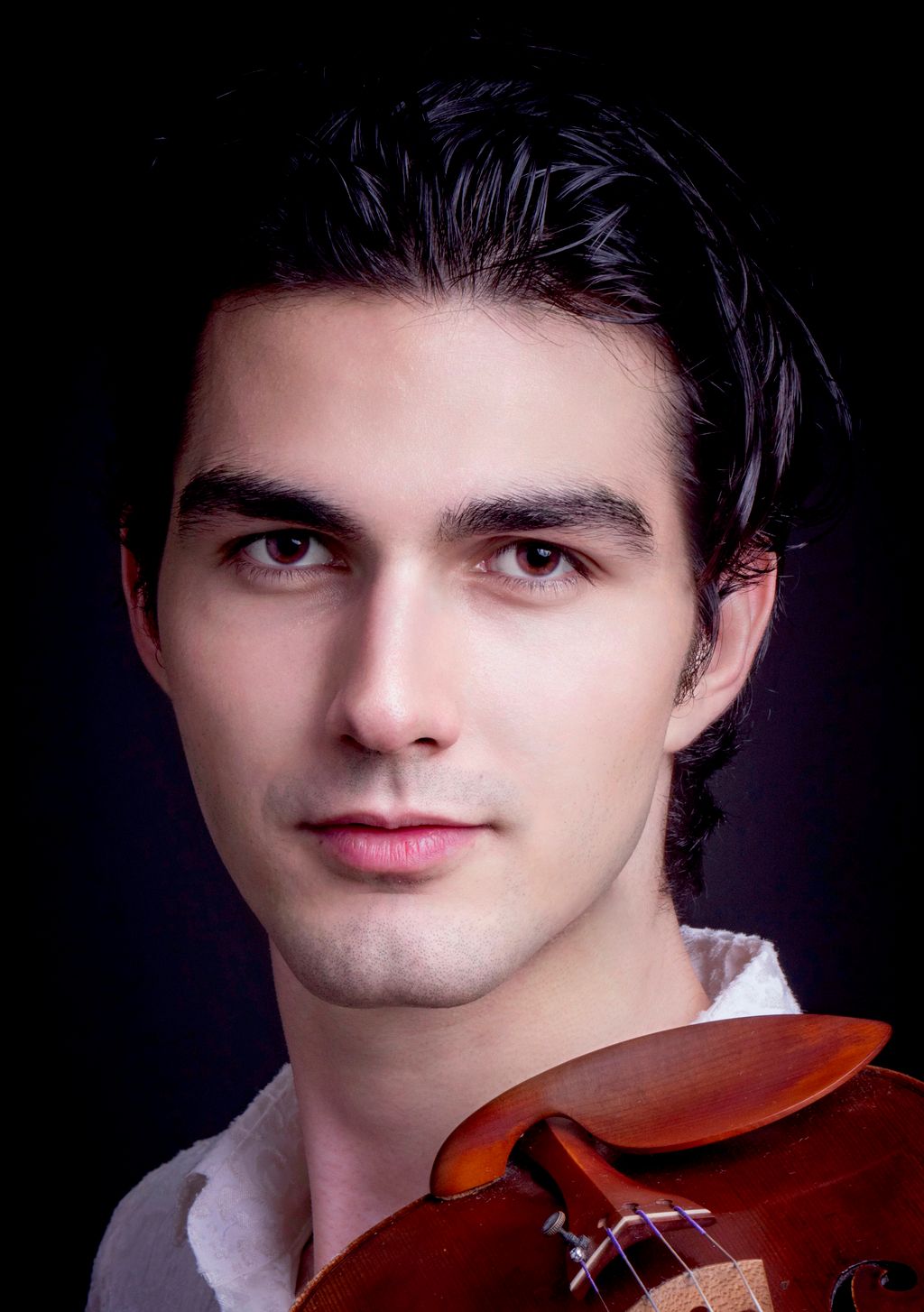 A professional headshot for my upcoming concerts