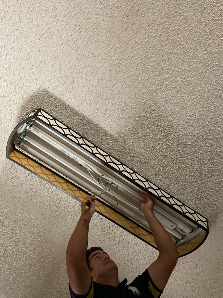 Before  Removal of out- dated lighting Fixture