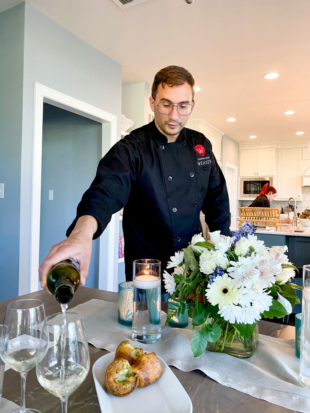 Tom pouring wine