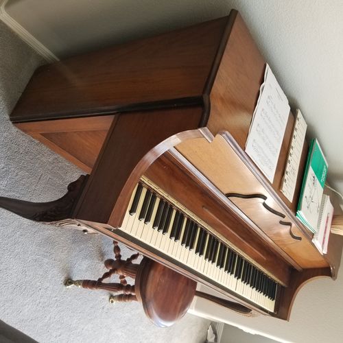 She fixed a key and tuned up our piano in the most