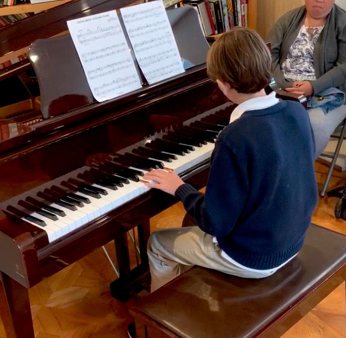 My son playing on a recital.