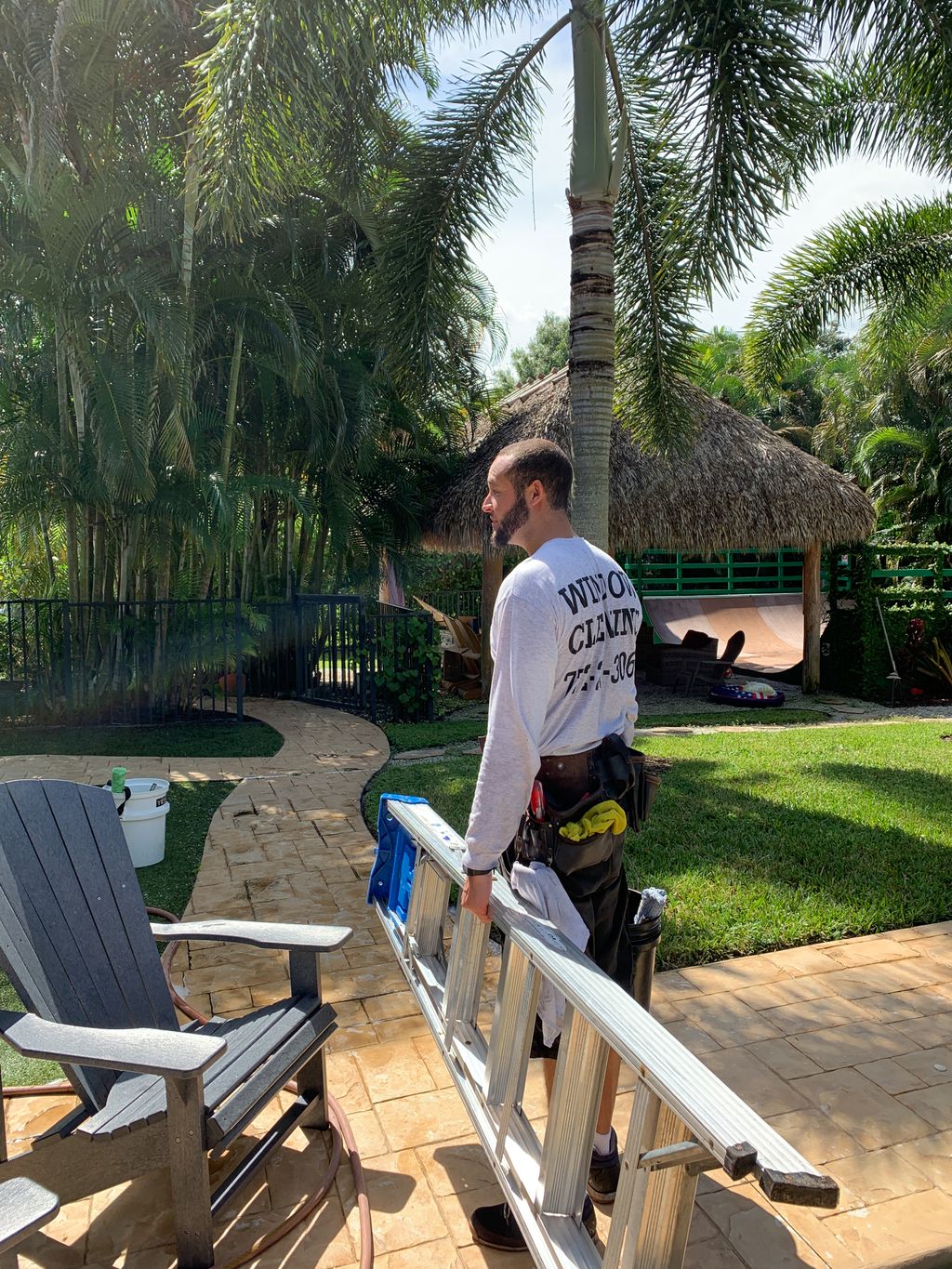 Window Cleaner in Stuart Carrying ladder