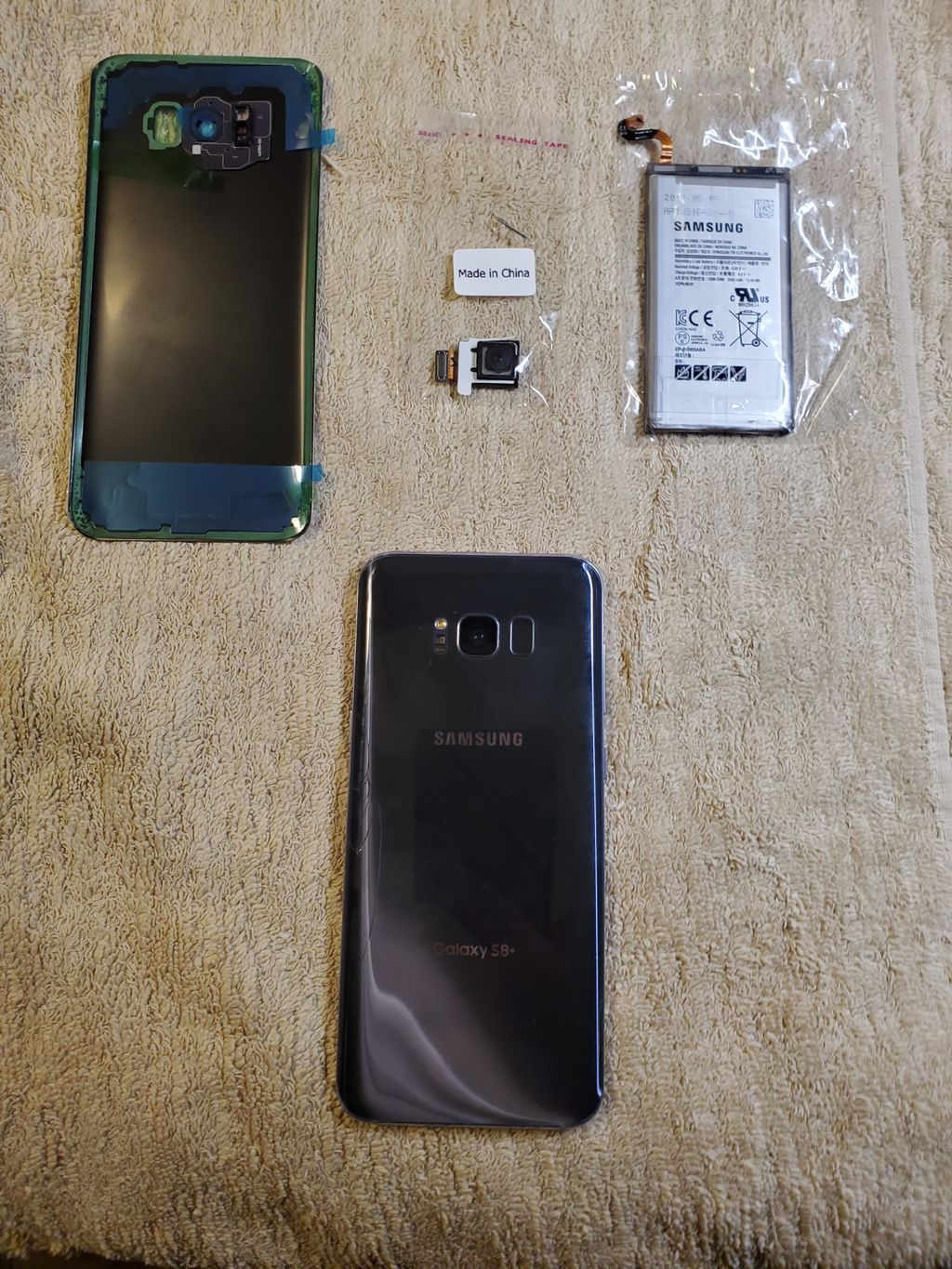 Replacement of back glass, battery, and new camera