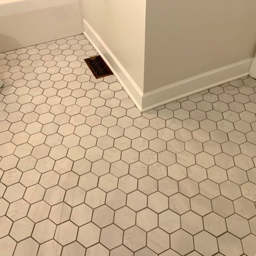 Mark removed old floor tile in our bathroom and in