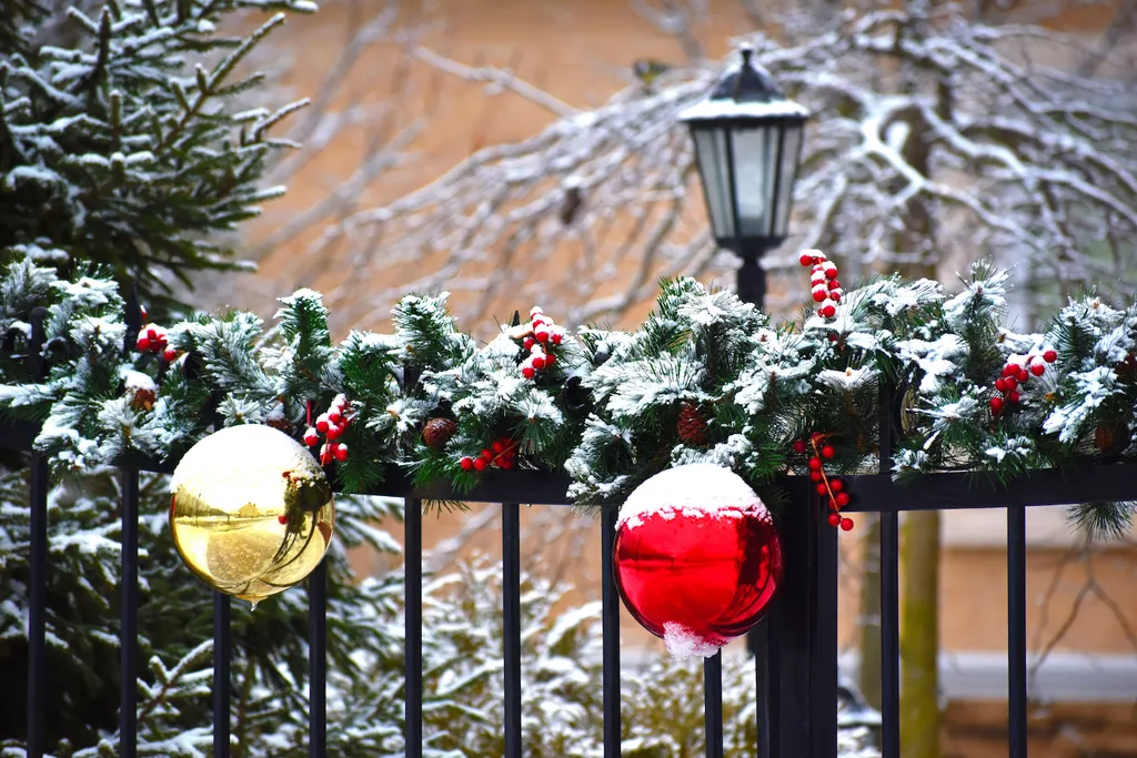 Christmas garland on fence gate
