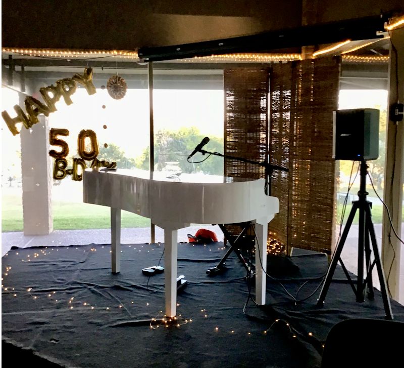 Portable white baby grand
