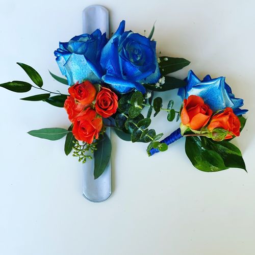 Blue and orange corsage and Boutonnière 