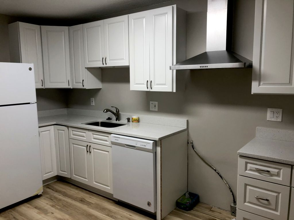 Cabinets  and exhaust fan installed, we were waiti