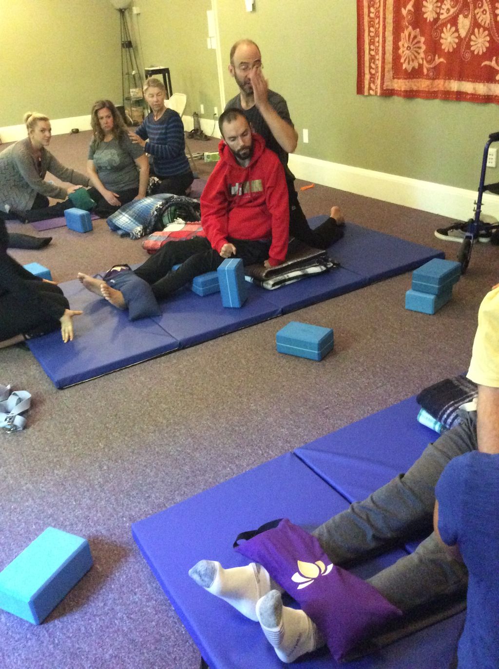 me, teaching adaptive Yoga, with students and assi