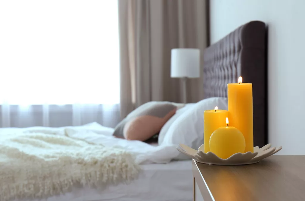 candle on bedside table