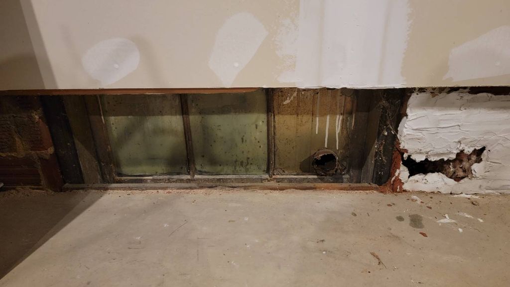 This is a basement window inside a garage. Along w