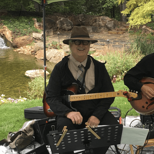 Playing at a recent outdoor wedding in Ken Garff's