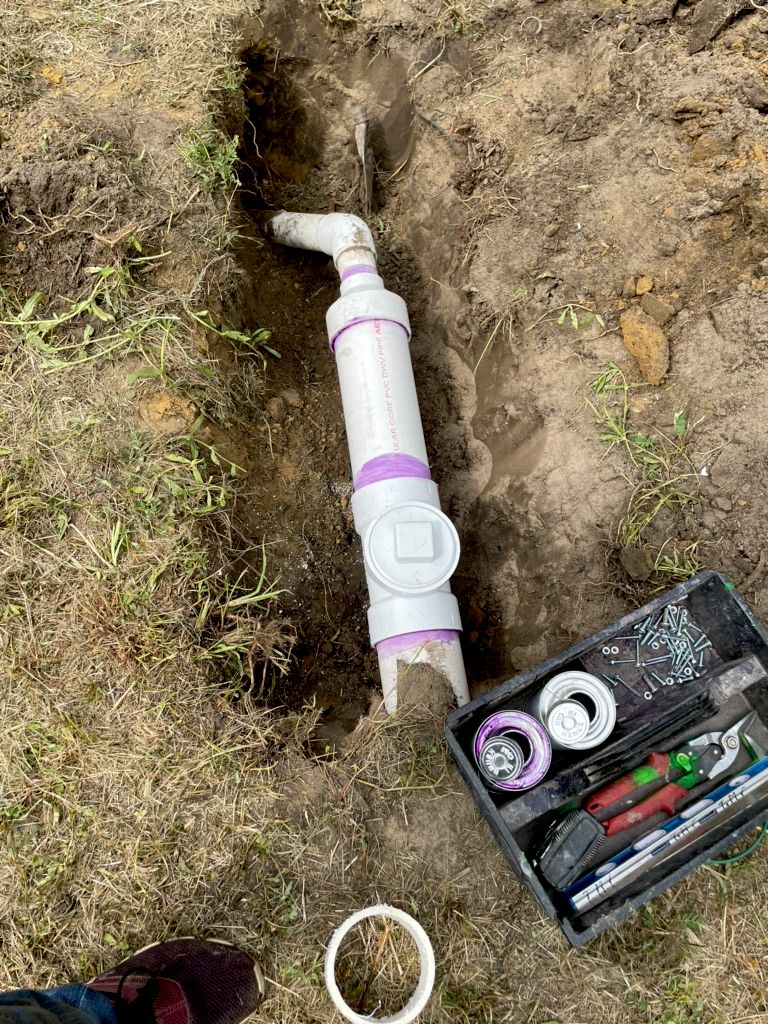 (2) fixed clean out with also 2 inches lower than 