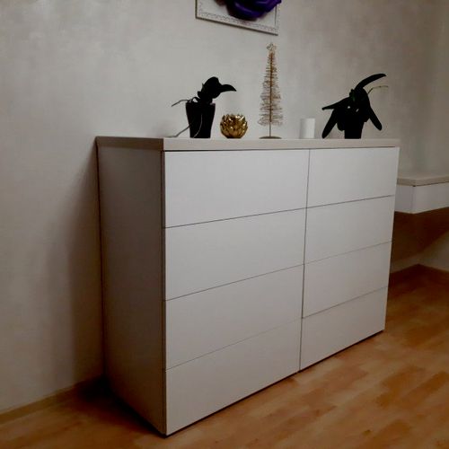Vitaly put together a chest of drawers.  The work 