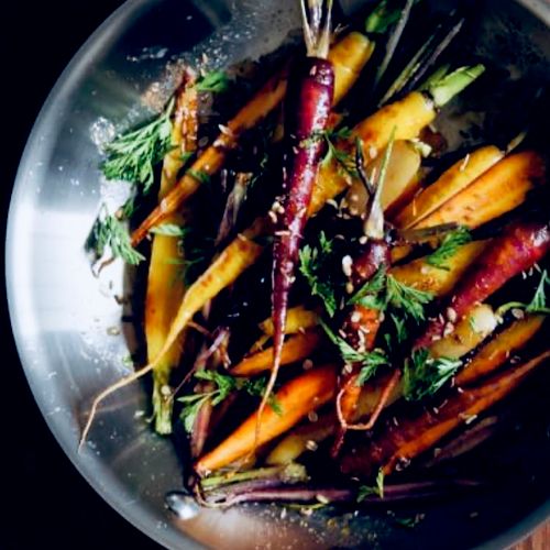 Roasted rainbow carrots .  Chili - sage butter .