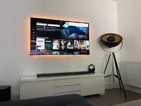 LED-backlit TV mount with soundbar by I Connect 4 U