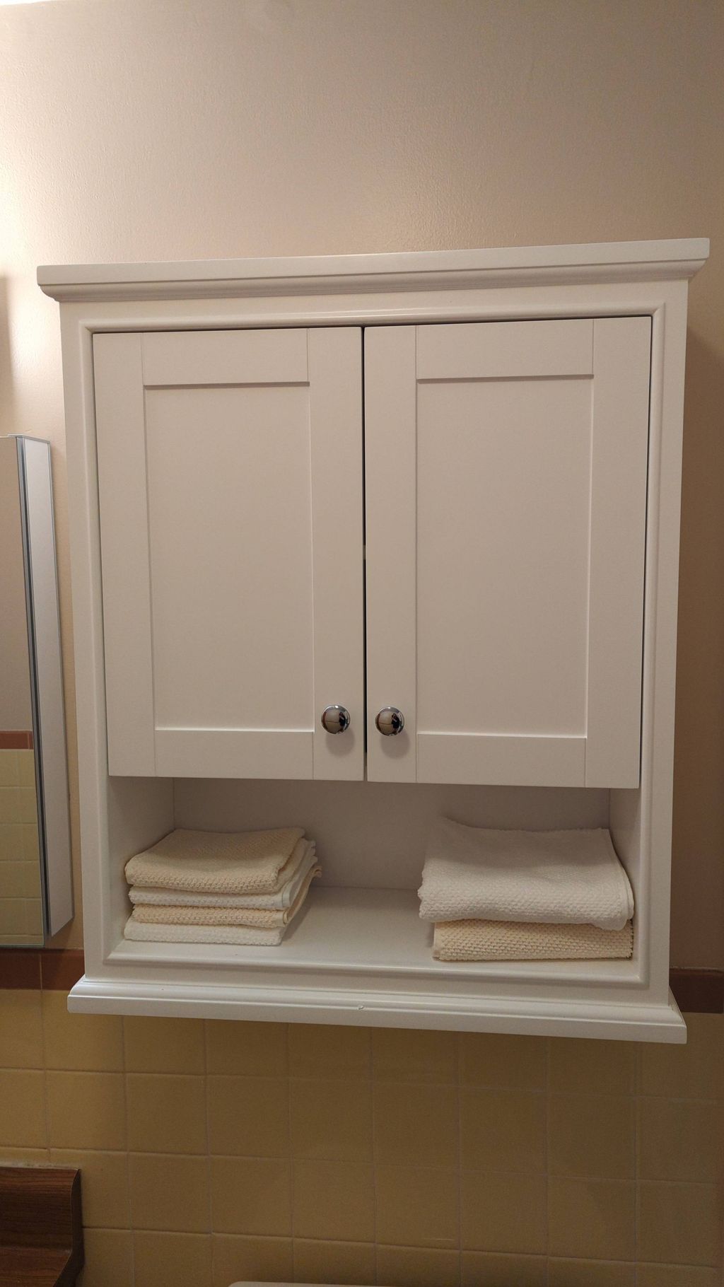 Wonderful job mounting a new bathroom cabinet. Muc