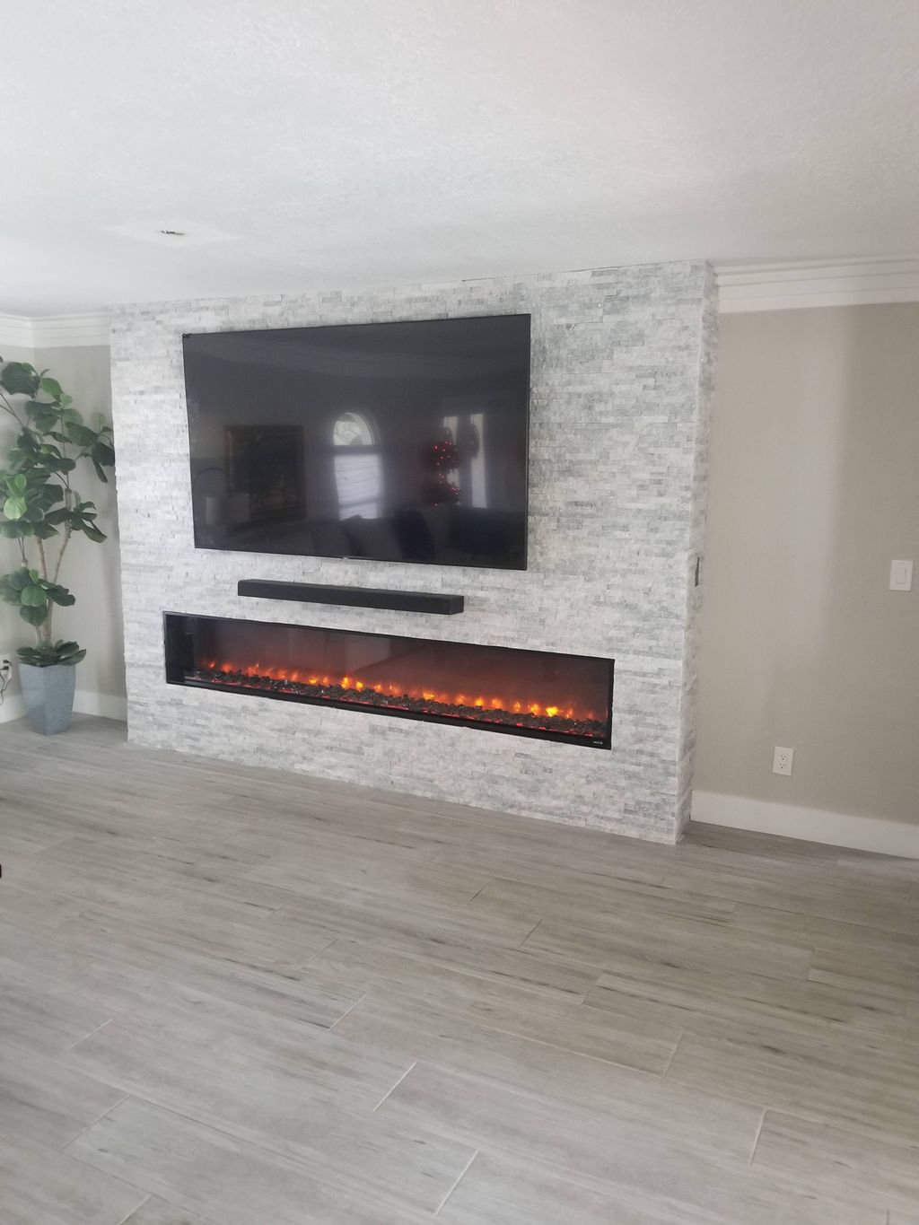 Build-out to accommodate fire box. Hung TV and sou