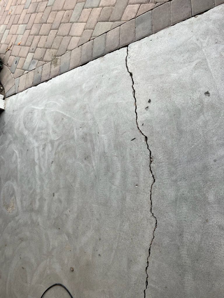 Before: Cracks on garage floor