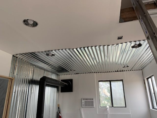 Textured, Painted Drywall, Recessed Lighting, Wood