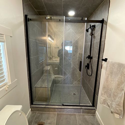 Installed two shower doors and finished out some o