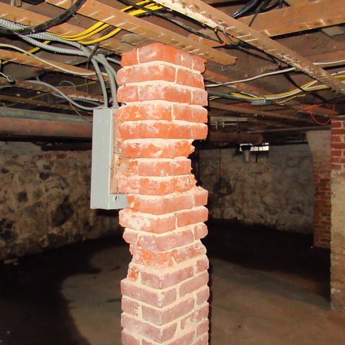 Deteriorated brick support column