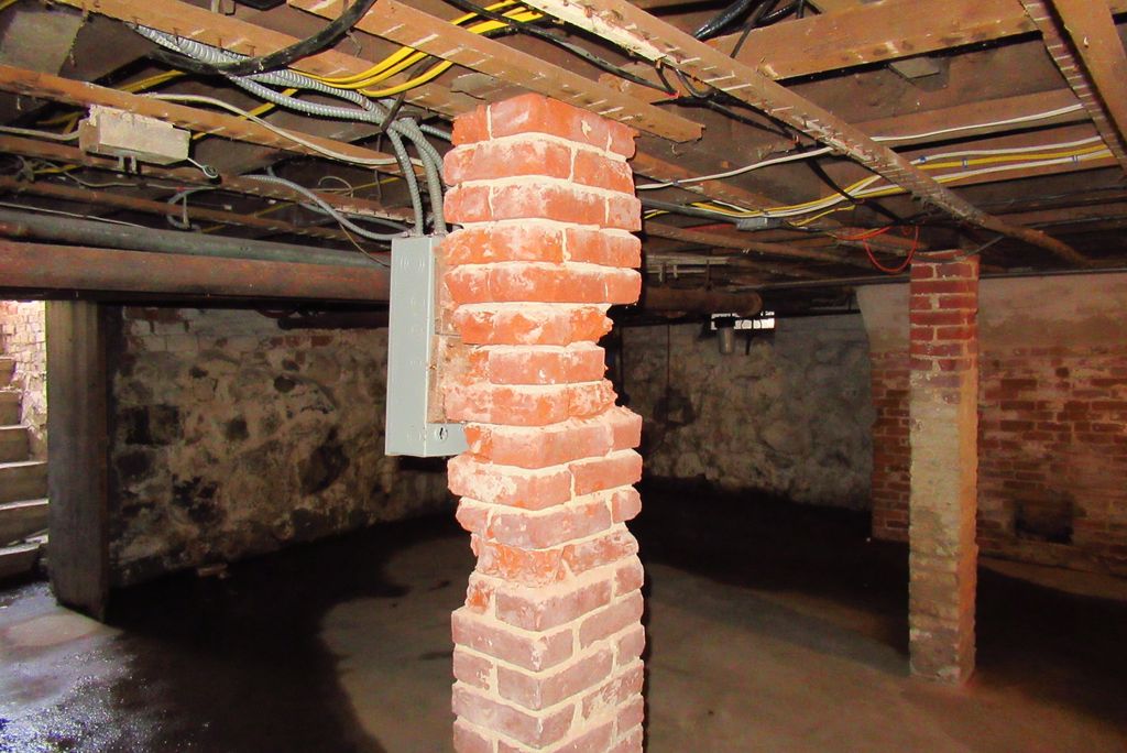 Deteriorated brick support column