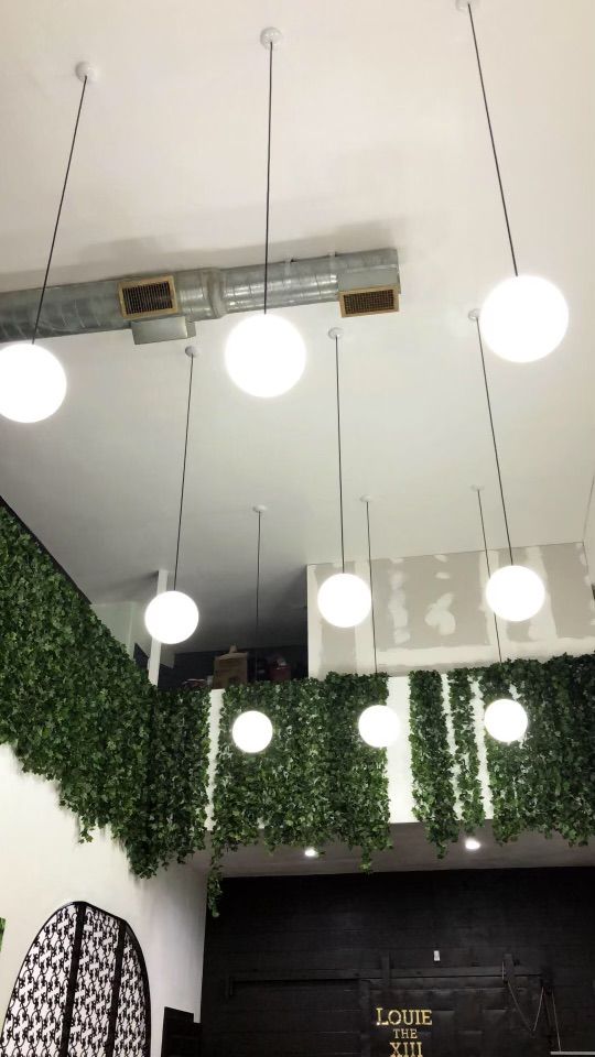 Custom 12-foot pendants installed from mezzanine c