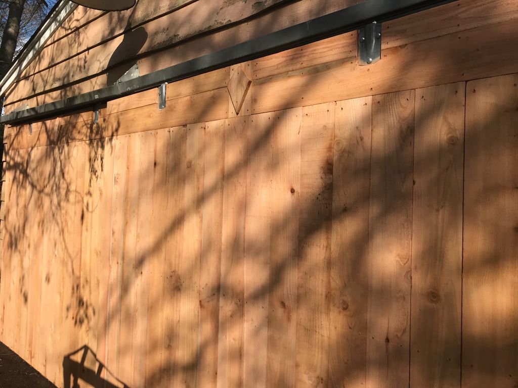 My barn-style garage door was broken, and Juan bui