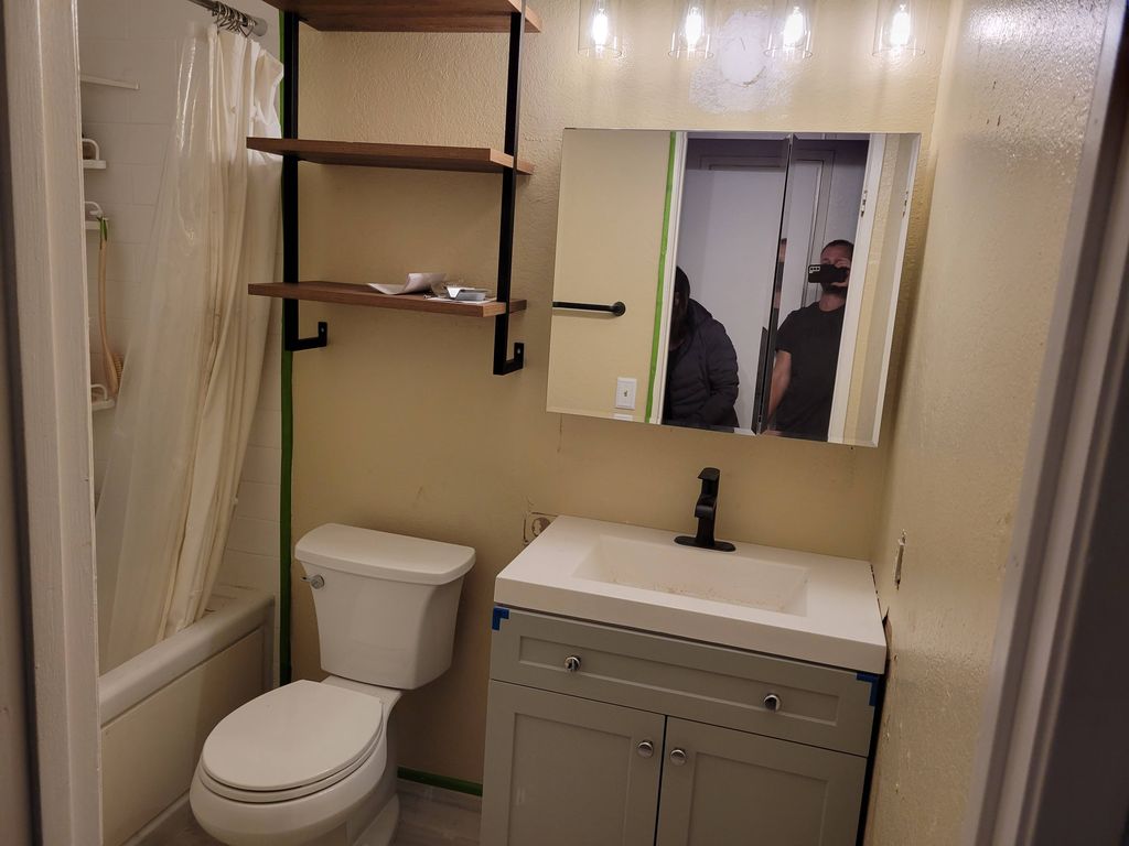 install toilet, shelves, medicine cabinet, vanity,